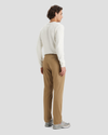 Back view of model wearing New British Khaki Signature Iron Free Khakis, Slim Fit with Stain Defender®.