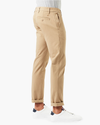 Side view of model wearing New British Khaki Ultimate Chinos, Skinny Fit.