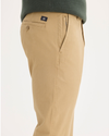 Side view of model wearing New British Khaki Ultimate Chinos, Slim Fit.