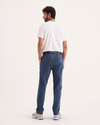Back view of model wearing Ocean Blue Alpha Chino Pants, Slim Fit.
