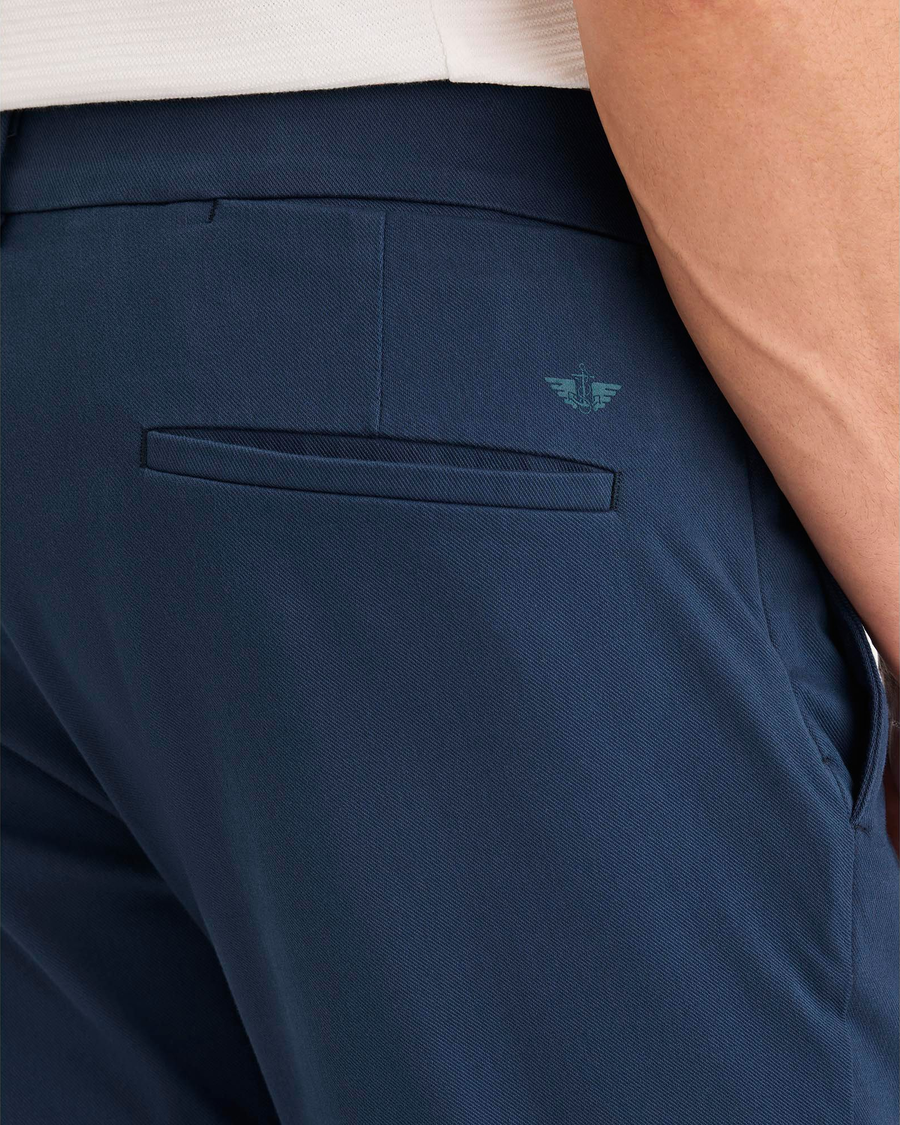 View of model wearing Ocean Blue Go Activeflex Chino, Skinny Fit.