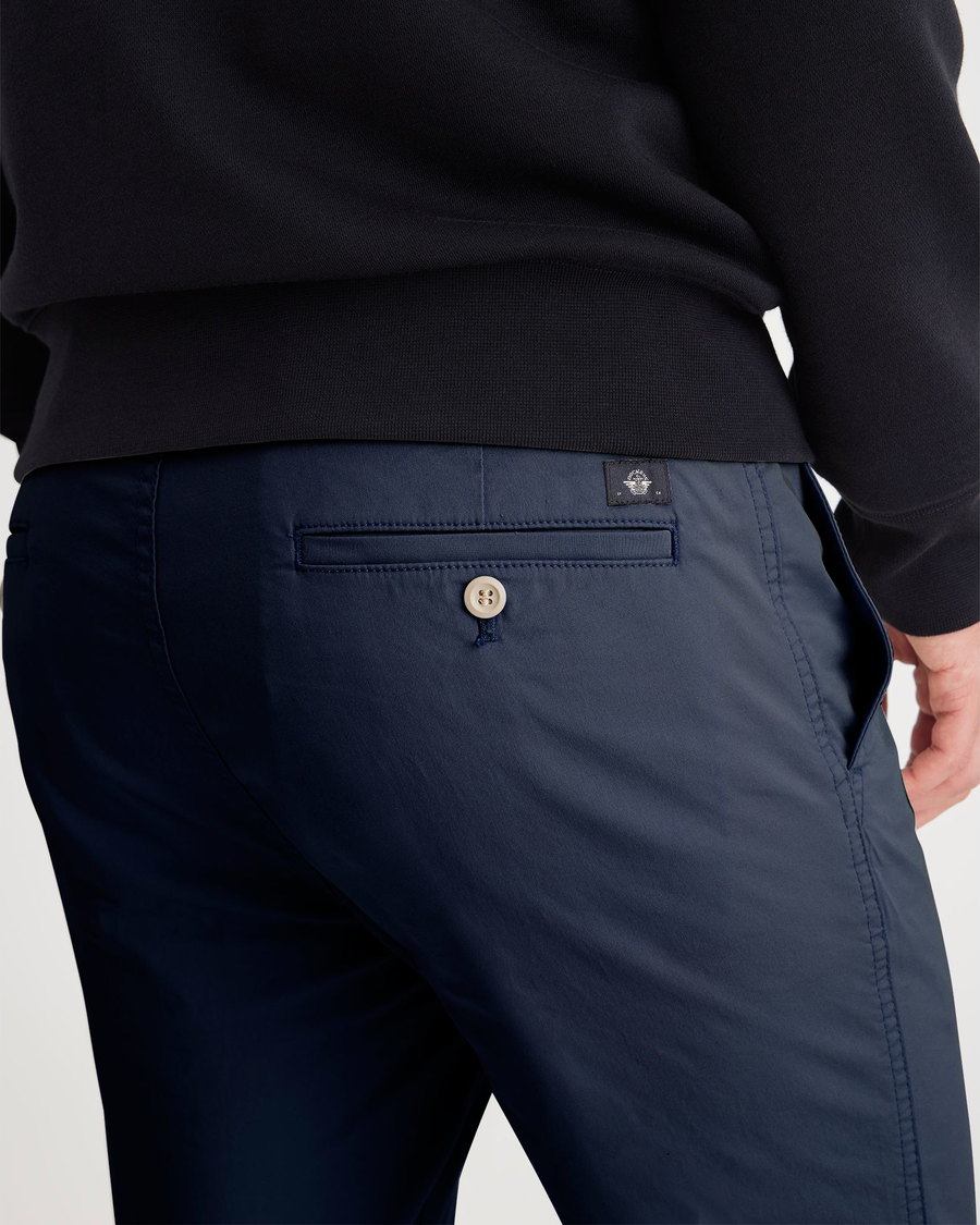 View of model wearing Ocean Blue Men's Skinny Fit Original Chino Pants.