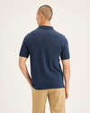 Back view of model wearing Ocean Blue Men's Slim Fit Pique Polo.