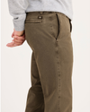 Side view of model wearing Otter Stonewash Alpha Chino Pants, Slim Fit.