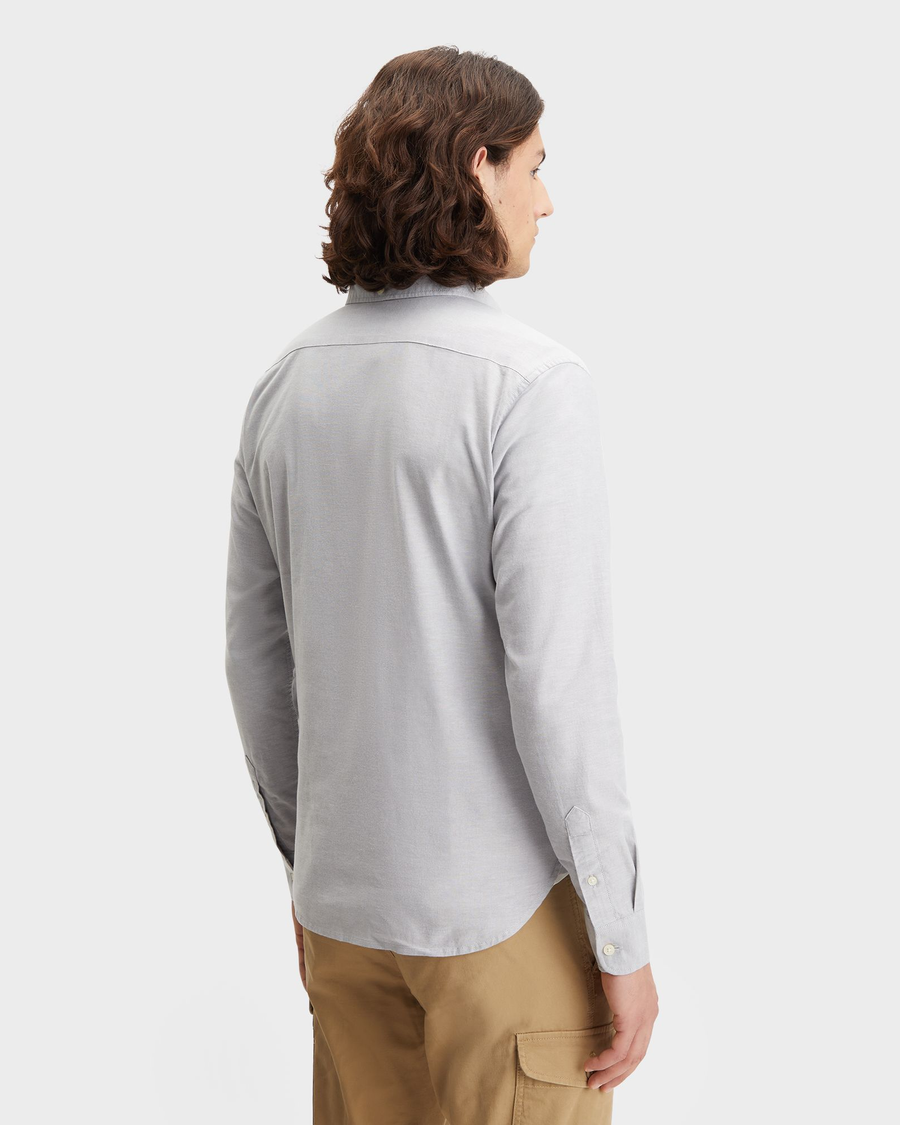 Back view of model wearing Oxford Medium Grey Heather Men's Slim Fit 2 Button Collar Shirt.