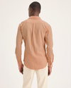 Back view of model wearing Peach Bloom Men's Slim Fit Icon Button Up Shirt.