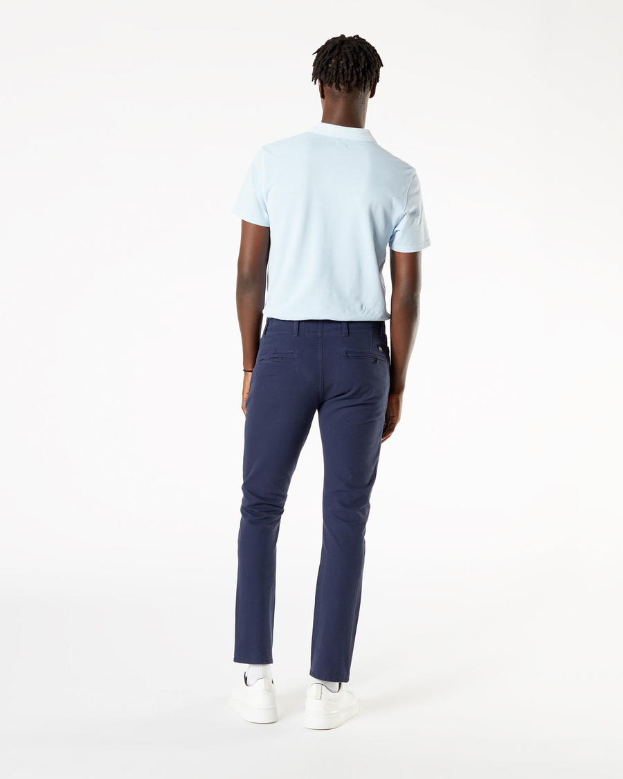 Back view of model wearing Pembroke Men's Skinny Fit Smart 360 Flex Alpha Khaki Pants.