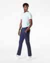 Side view of model wearing Pembroke Men's Skinny Fit Smart 360 Flex Alpha Khaki Pants.