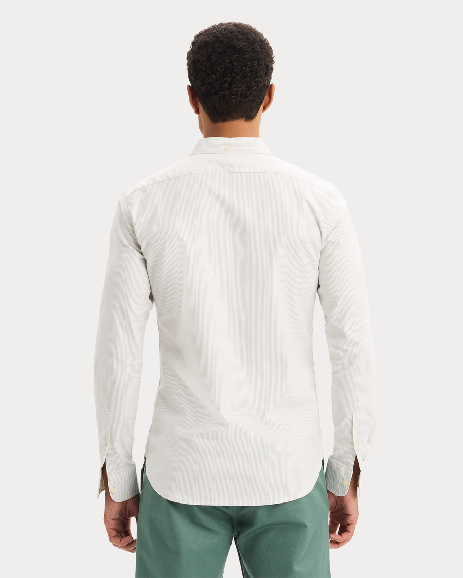 View of model wearing Playoff Tea 2 Button Collar Shirt, Slim Fit.