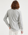 Back view of model wearing Rock Grey Heather Men's Slim Fit Icon Button Up Shirt.