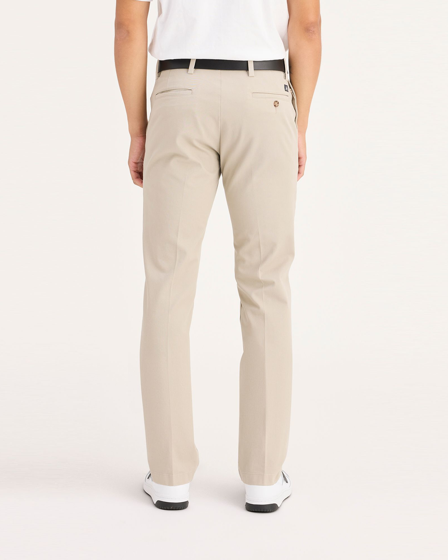 Back view of model wearing Safari Beige Workday Khaki Pants, Slim Fit.