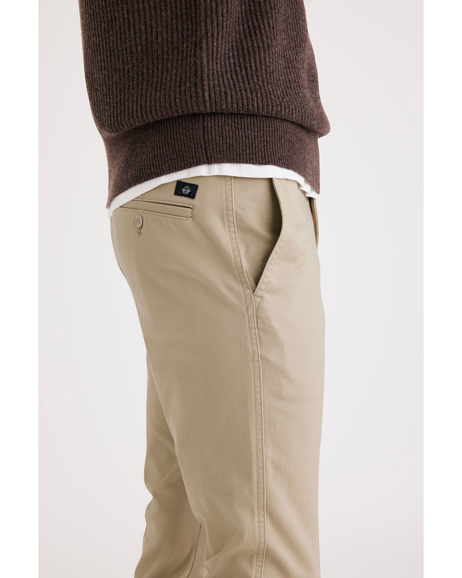 Side view of model wearing Safari Men's Skinny Fit Original Chino Pants.