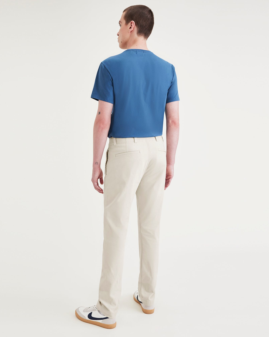 Back view of model wearing Sahara Khaki Alpha Chino Pants, Skinny Fit.