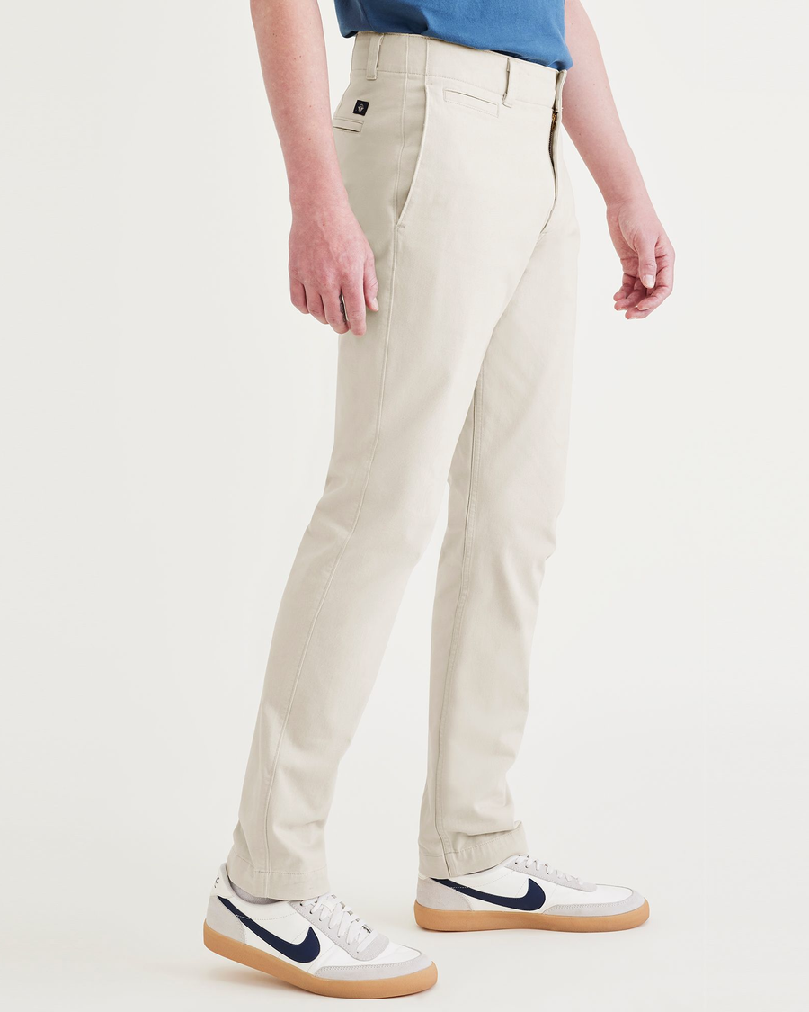 Side view of model wearing Sahara Khaki Alpha Chino Pants, Skinny Fit.