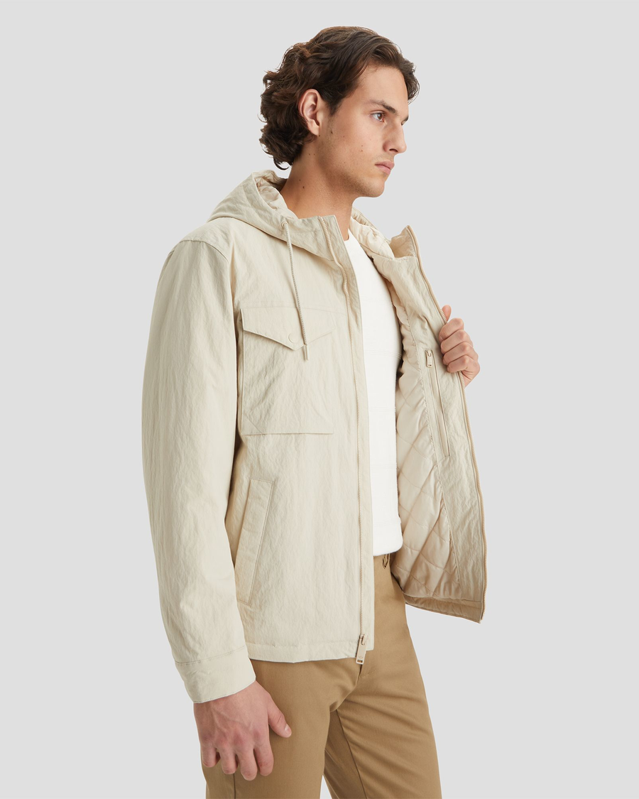 View of model wearing Sahara Khaki Men's Sail Recycled Nylon Jacket.
