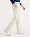 Side view of model wearing Sahara Khaki Men's Slim Fit Original Chino Pants.