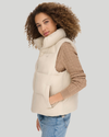 Side view of model wearing Sahara Khaki Women's Puffer Vest Jacket.