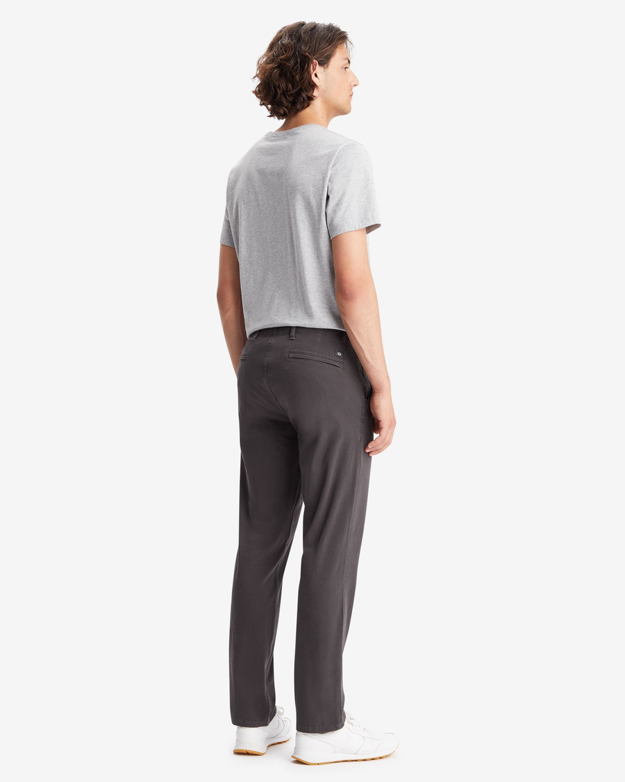 Back view of model wearing Steelhead Men's Slim Fit Smart 360 Flex Alpha Khaki Pants.