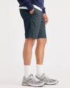 Side view of model wearing Stratified Sea Alpha Chino Shorts, Straight Fit.