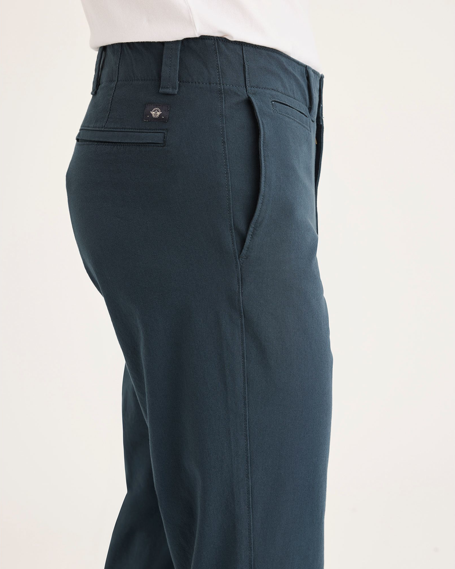 Side view of model wearing Stratified Sea Men's Slim Fit Smart 360 Flex California Chino Pants.