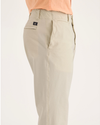 Side view of model wearing Summer Earth Alpha Chino Pants, Slim Fit.