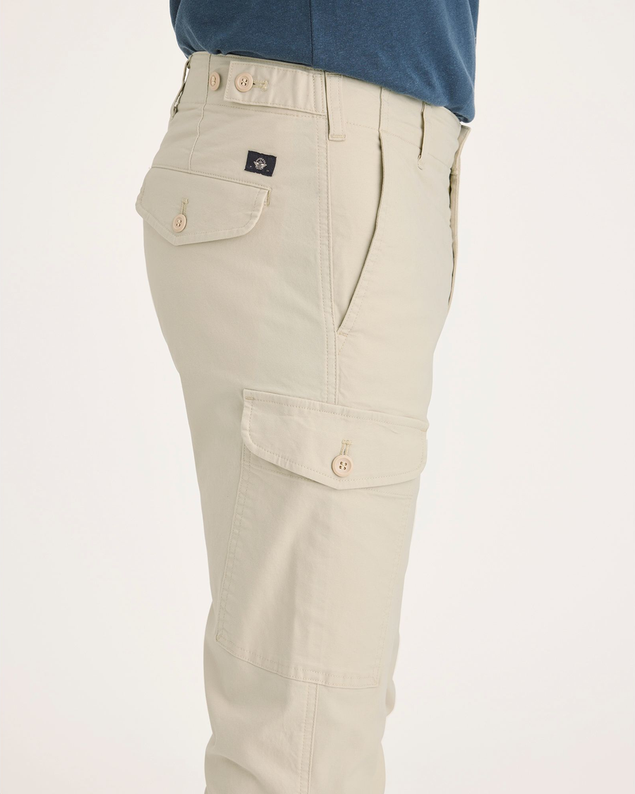 Side view of model wearing Summer Earth Men's Slim Tapered Fit Cargo Pants.