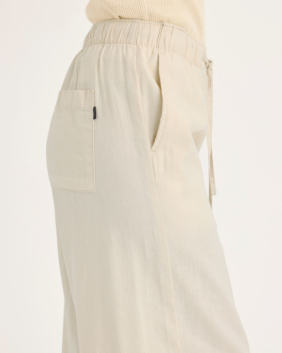 Side view of model wearing Summer Earth Women's Drawstring Pants.