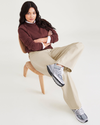 View of model wearing Tan Garment Dye Women's Relaxed Fit Mid-Rise Jeans.