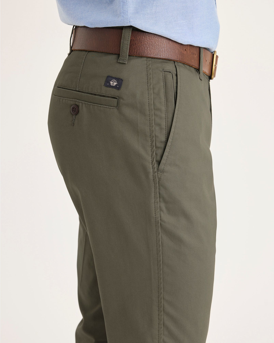 Side view of model wearing Tea Leaf Men's Smart 360 Flex Ultimate Chino.