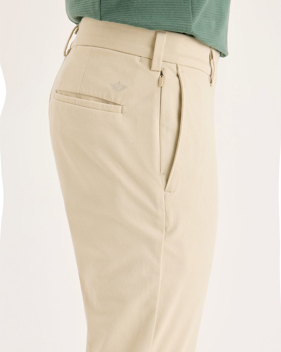 Side view of model wearing Tidal Foam Go Activeflex Chino, Skinny Fit.