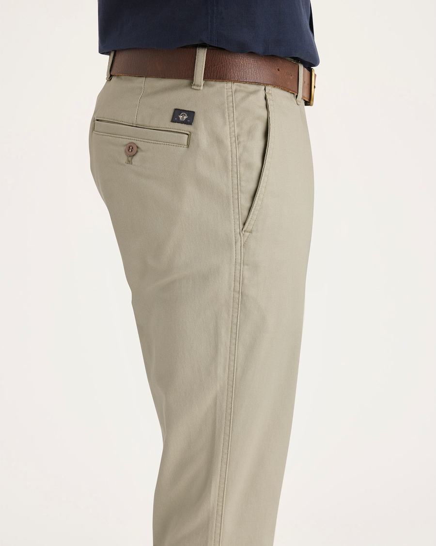 Side view of model wearing Tidal Foam Men's Skinny Fit Original Chino Pants.