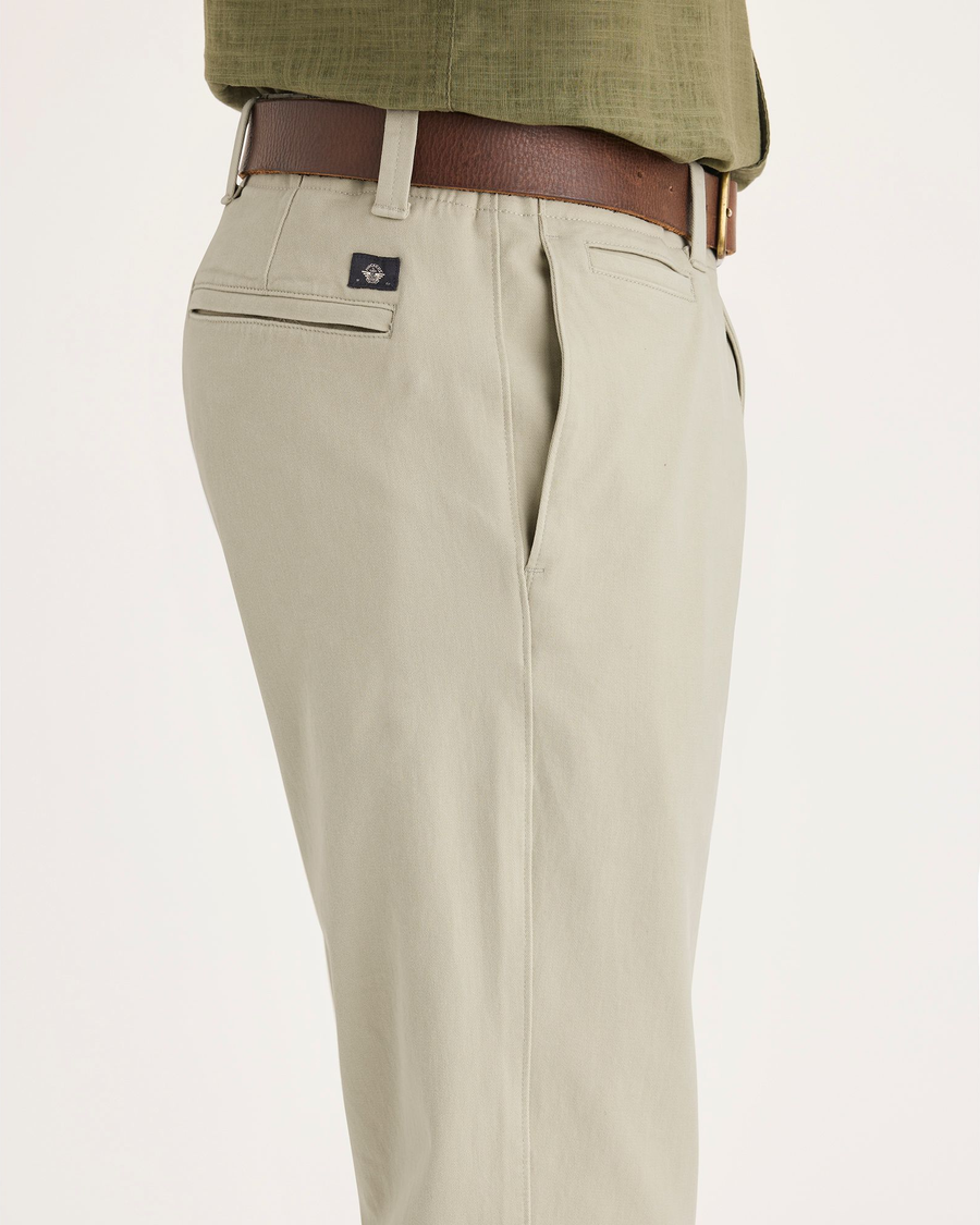 Side view of model wearing Tidal Foam Men's Slim Fit Smart 360 Flex California Chino Pants.