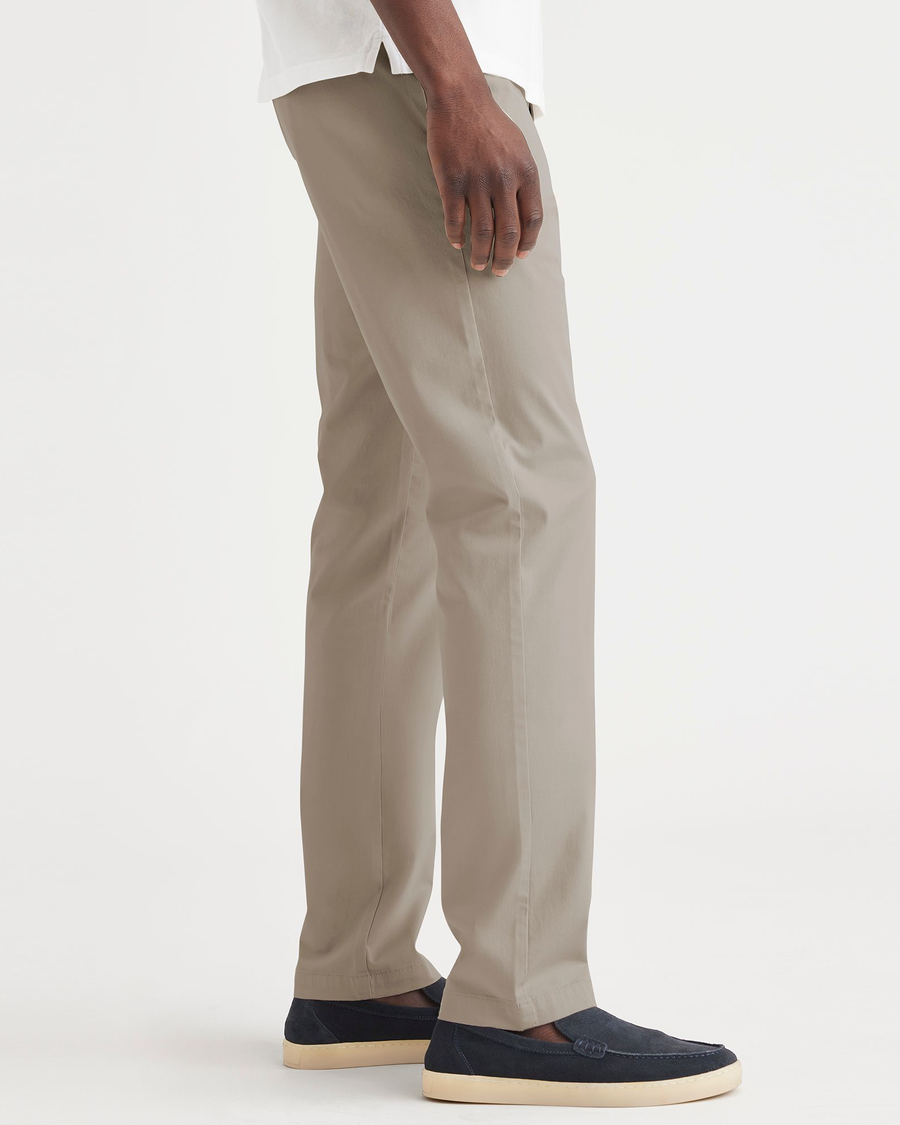 Side view of model wearing Timber Wolf Men's Slim Fit Original Chino.