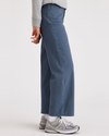 Side view of model wearing Vintage Indigo Women's Straight Fit High Jean Cut Pants.